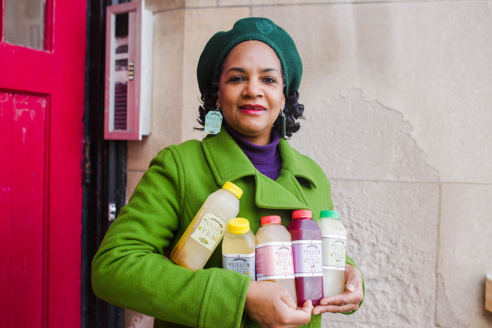 Nikki and five of her teas.